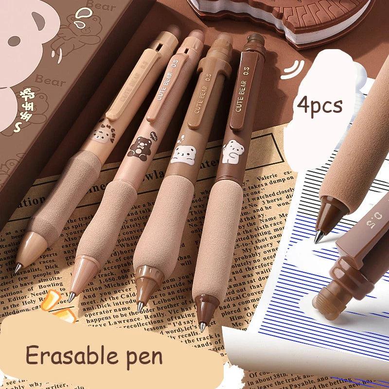 Set of four soft grip gel pens with cute bear and paw prints on light tan barrels