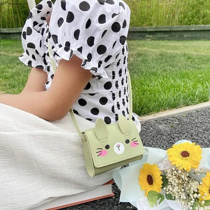 Green bunny crossbody bag with stitched face and adjustable shoulder strap
