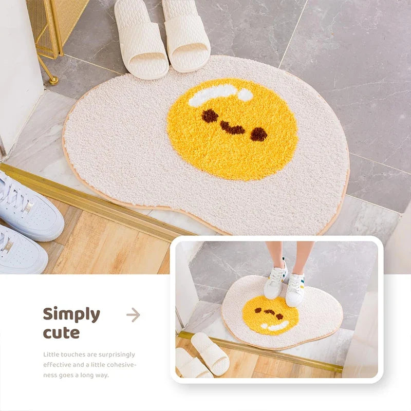 Cute egg bath mat rug with yellow smiling egg face, oval shape on bathroom floor