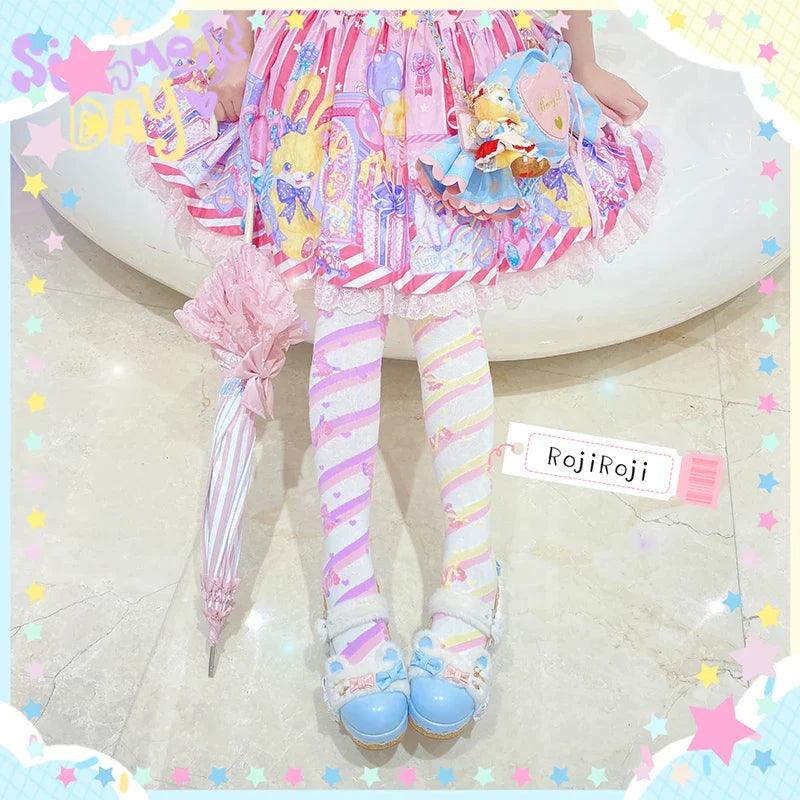 Knee-high socks with striped pattern in pastel pink, yellow, and light purple