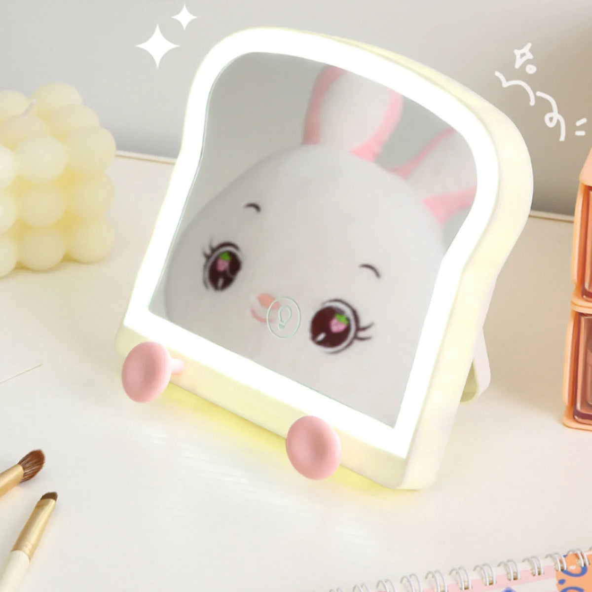 Toast-shaped LED makeup mirror with bunny graphic, warm light ring and phone stand pegs