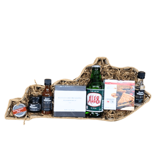 Straw gift basket with assorted bottles, sauces, and spice packets