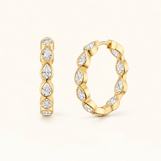 Gold-tone marquise hoop earrings with stacked clear stones, hinged oval profile