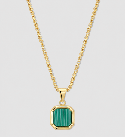 Gold chain necklace with green square pendant set in a gold bezel