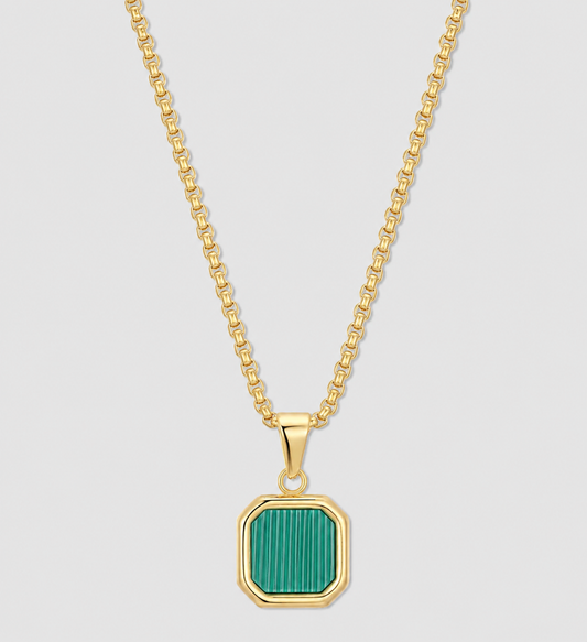 Gold chain necklace with green square pendant set in a gold bezel