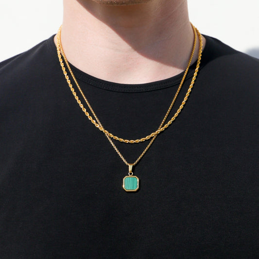 Gold-tone double necklace with turquoise rectangular pendant stone at center