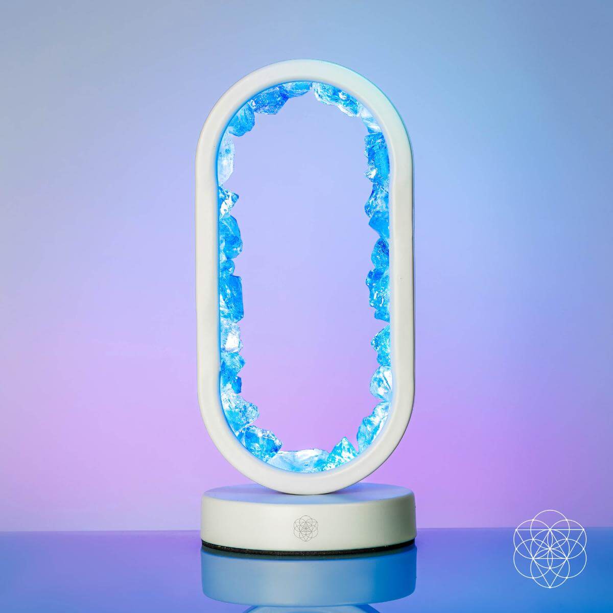 Clear quartz achievement lamp glowing blue oval centerpiece on white base