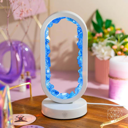 Clear quartz achievement lamp glowing blue oval frame on white base