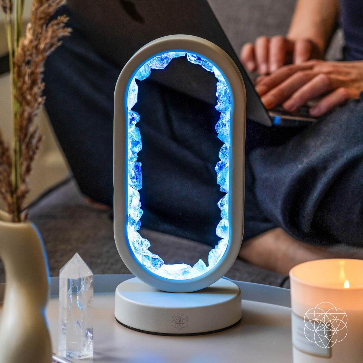 Clear quartz achievement lamp glowing blue oval frame on white circular base