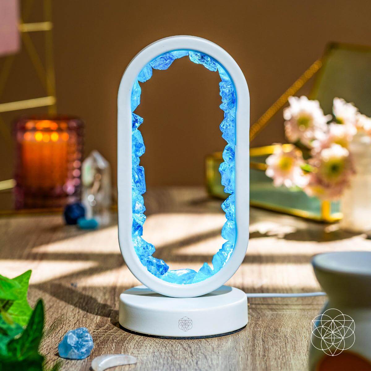 Clear quartz achievement lamp glowing blue oval centerpiece on white base