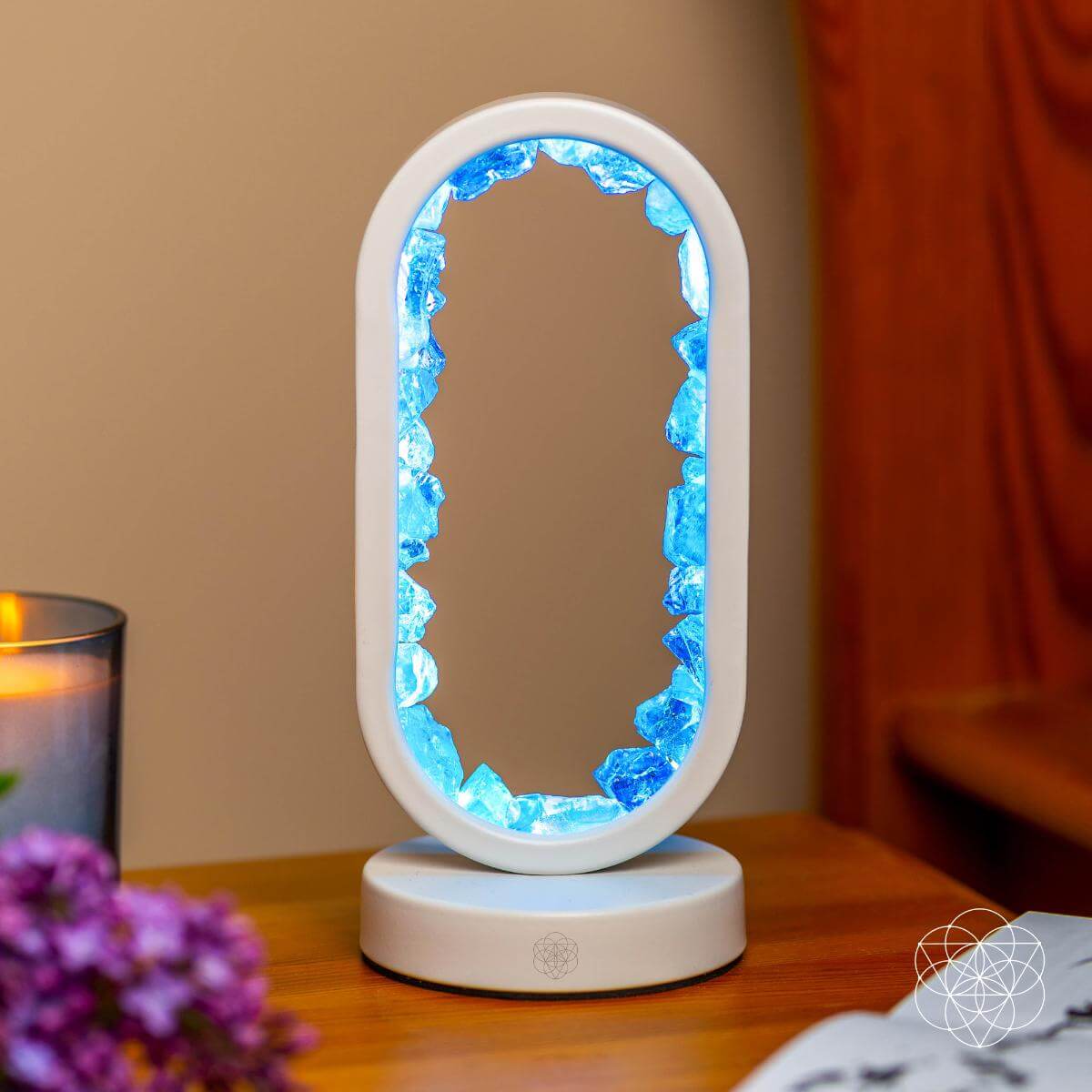 Clear quartz achievement lamp glowing blue oval centerpiece on white base
