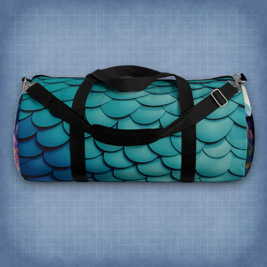 Teal mermaid-scales duffel bag with black webbing straps and metal zipper pulls.