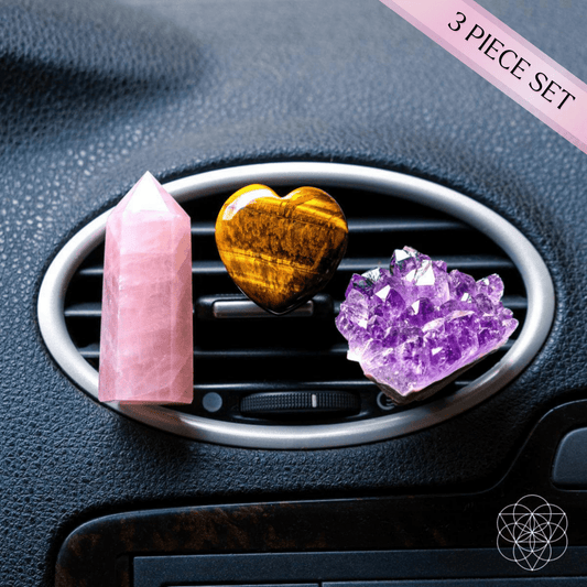 Crystal car air vent clip set with pink quartz tower, tiger eye heart, and amethyst cluster