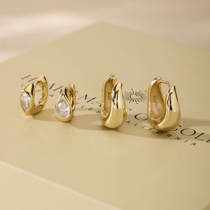Gold-tone wavy hoop earring set with clear stones and smooth hoops
