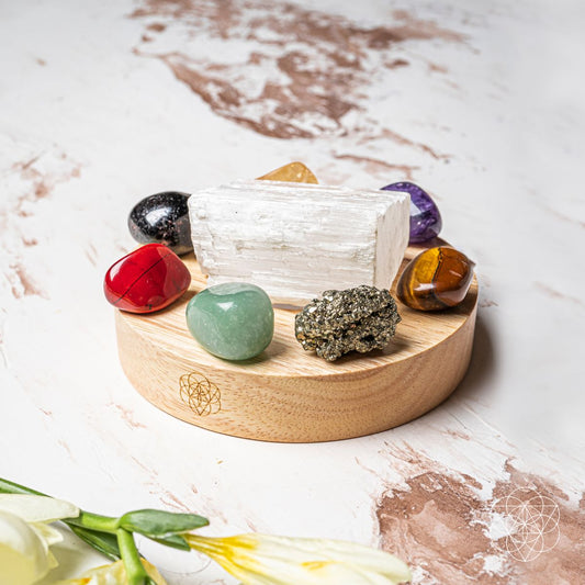 Crystals on a round wooden base with multicolor gemstones and clear crystal piece