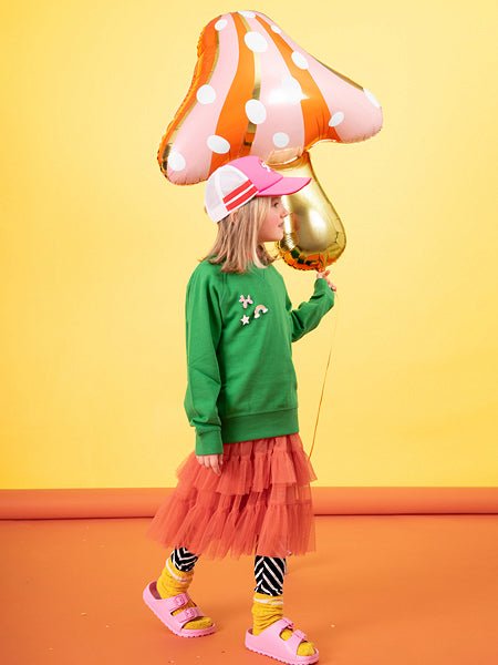 Mushroom-shaped balloon with gold foil stem and orange polka-dot cap