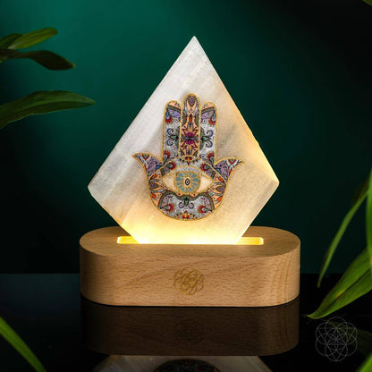Glowing pyramid mood lamp with Hamsa print on round wooden base