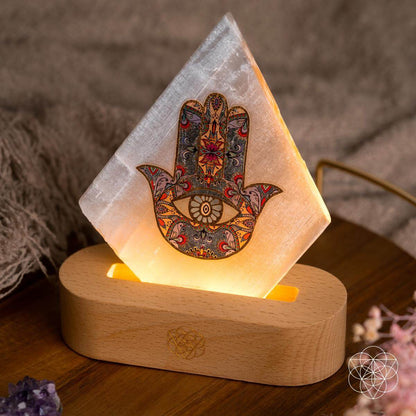 Glowing pyramid mood lamp with Hamsa print on round wooden base