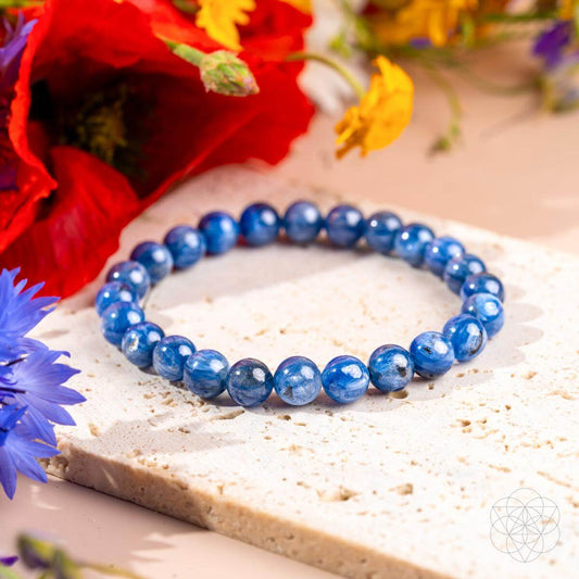 Rare kyanite beaded bracelet with round deep-blue stones on a light stone base