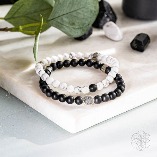 Black-and-white beaded bracelet set with silver-tone flower-of-life charm