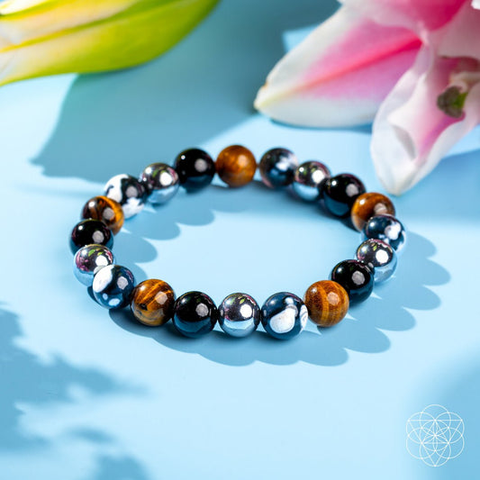 Round beaded healing bracelet with black, brown, and silver tone beads