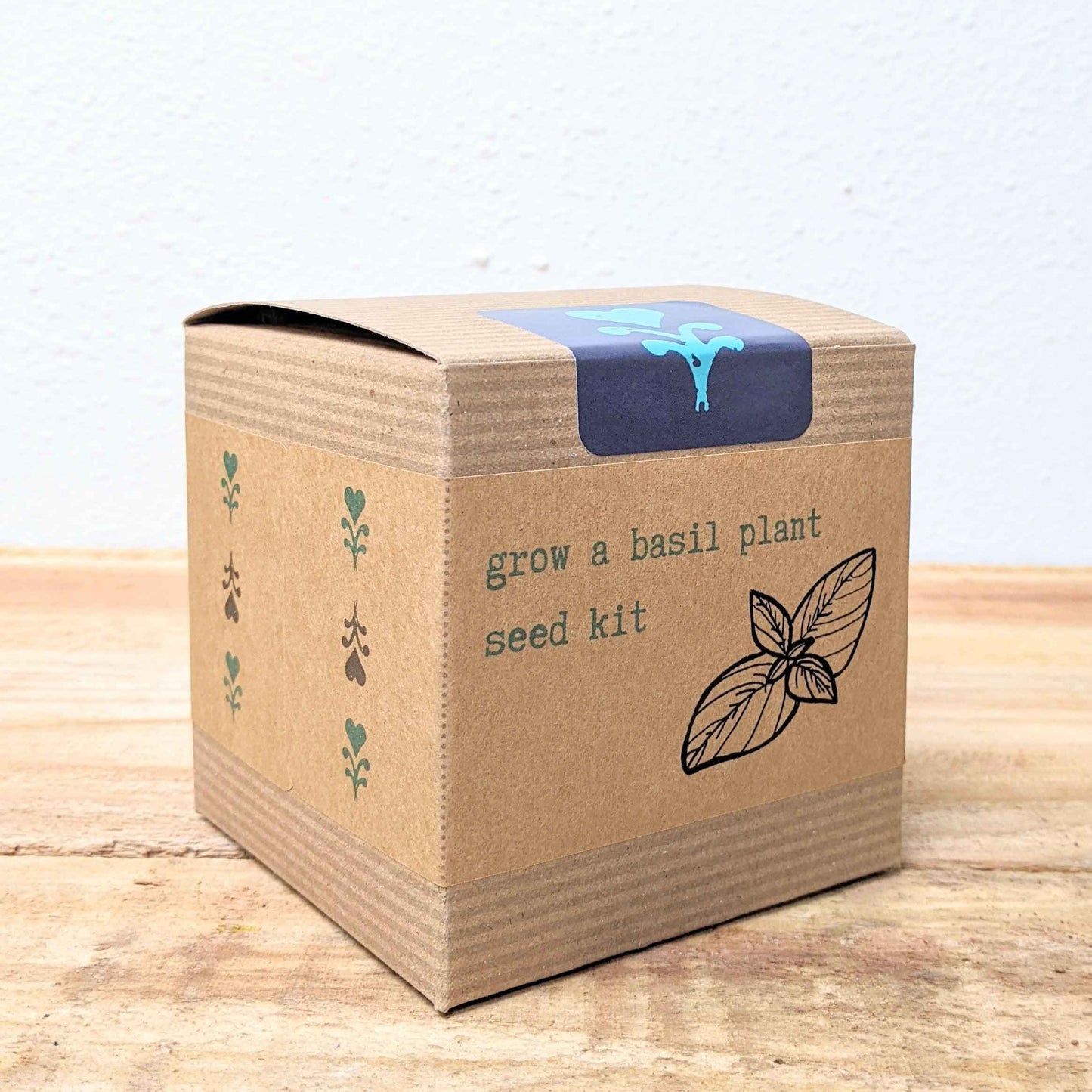 Kraft basil seed kit box with blue top label and leaf icon