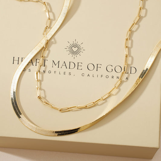 Gold-plated herringbone and paperclip necklaces, stacked with lobster clasps