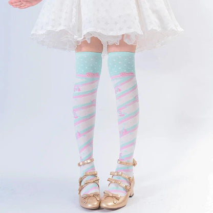 Knee-high socks in light mint with pastel rainbow stripes and tiny heart pattern