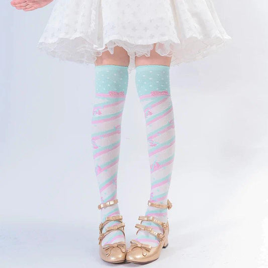 Knee-high socks in light mint with pastel rainbow stripes and tiny heart pattern