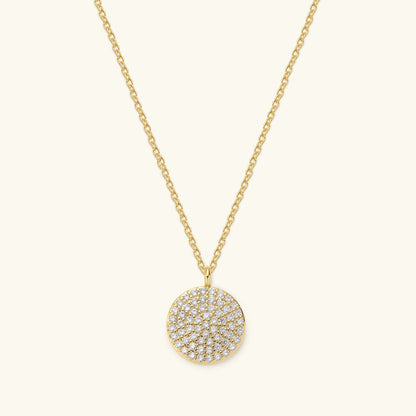 Gold necklace with round pavé disc pendant