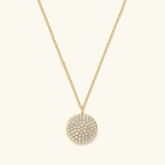 Gold necklace with round pavé disc pendant