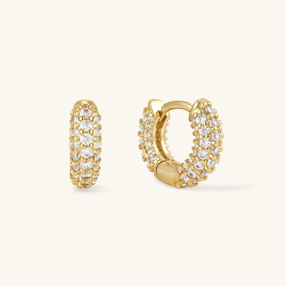 Gold pavé huggie hoop earrings with round clear stones
