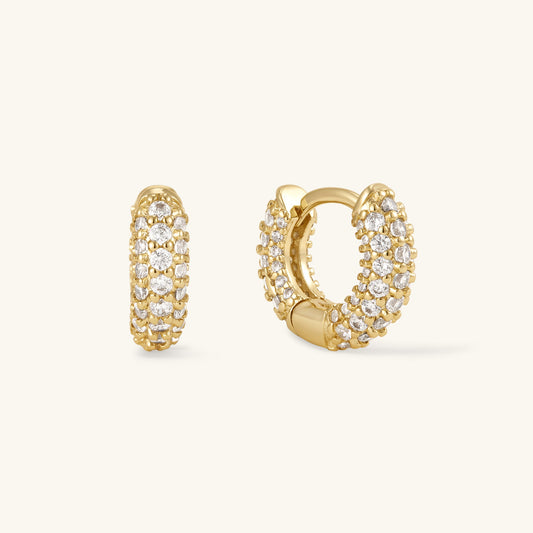 Gold pavé huggie hoop earrings with round clear stones