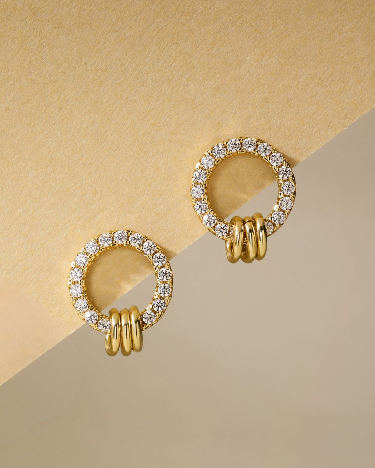 Gold pave circle stud earrings with clear stones and three hoop accents