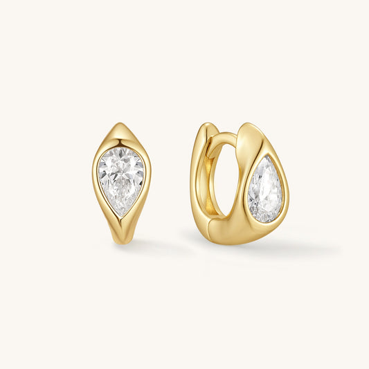 Gold-tone pear-cut huggie earrings with teardrop crystal stones