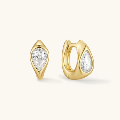Gold-tone wavy hoop earrings with clear round stones, hinged pair