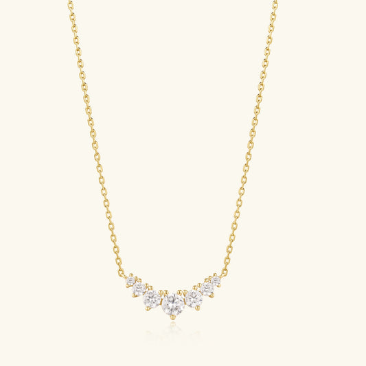 Gold chain cluster diamond necklace with a small teardrop pendant