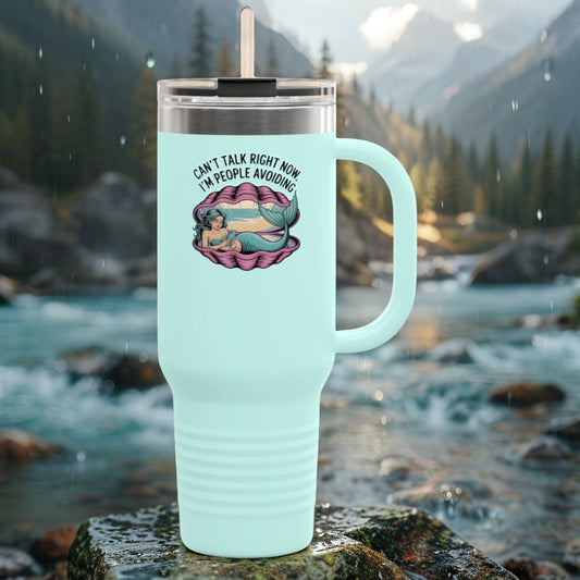 Mint teal insulated travel mug with lid and straw, front introvert slogan graphic