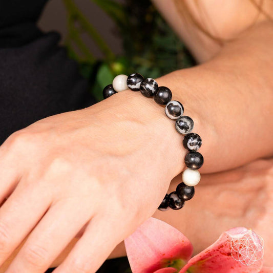 Beaded zebra jasper bracelet on wrist, black and white round stones