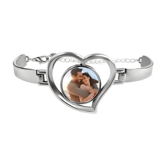 Heart-shaped photo bracelet with silver-tone frame and clasp, featuring a couple photo