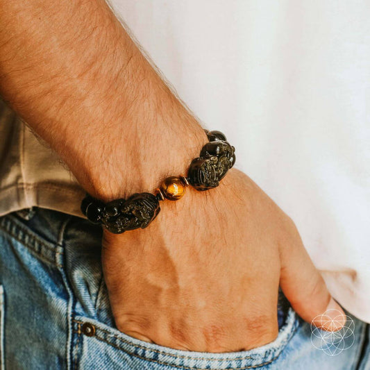 Pi Yao wealth bracelet on wrist with black beads and gold spacer beads