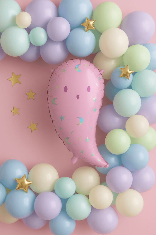 Pink ghost-shaped foil balloon with crescent moons and star accents