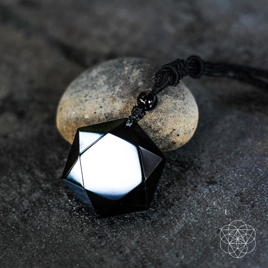 Geometric black obsidian pendant on black braided cord with small bead detail