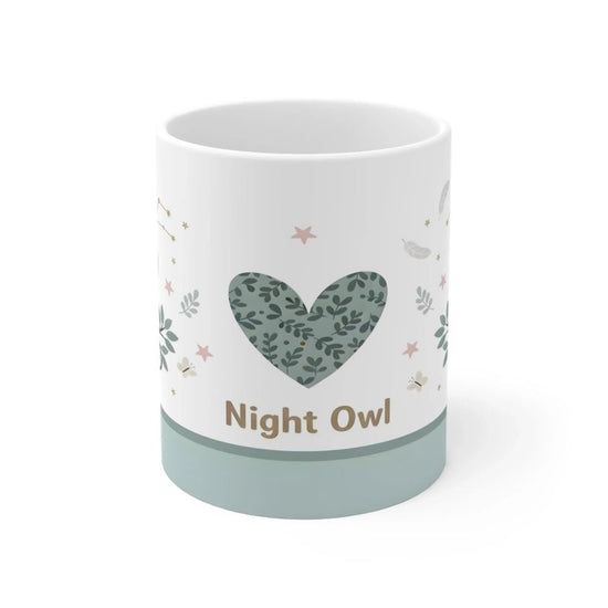 Personalized owl coffee, tea, chocolate milk mugs custom printed with cute cartoon owls on branches, constellations, and the name 'Dani', displayed on an office desk with a laptop as a custom gift set.