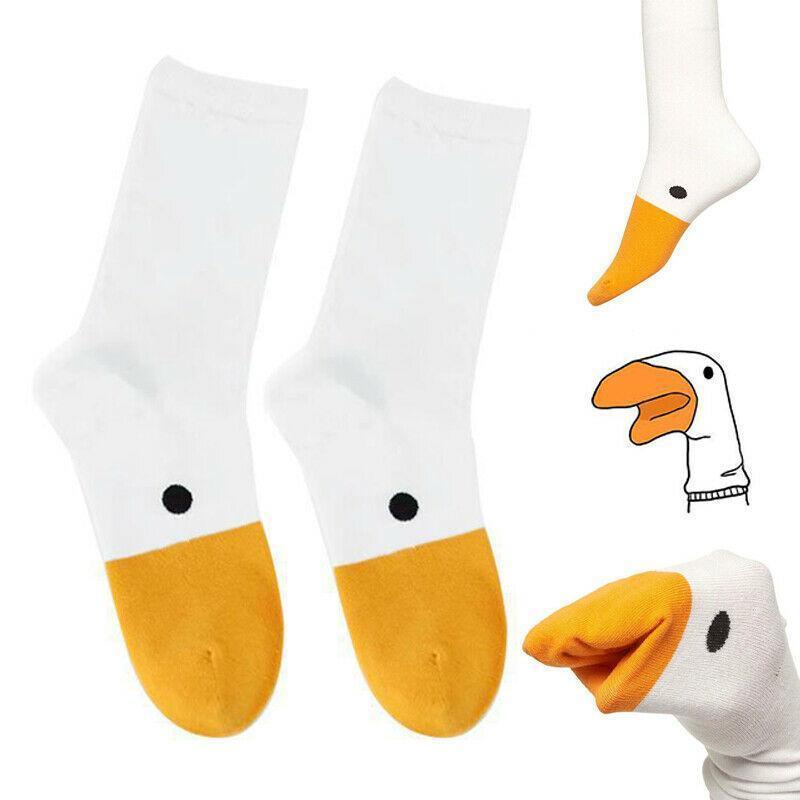White crew socks with orange toe and heel, black dot detail