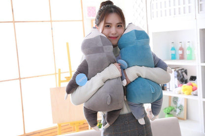 Blue and grey sleeping sloth plush with long arms and closed-eye face
