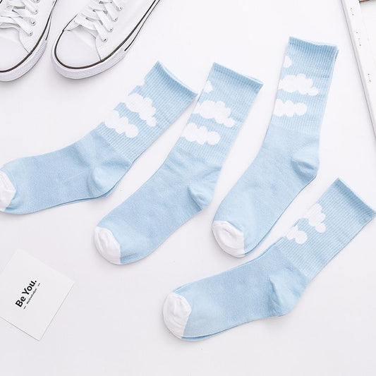 Light blue socks with white cloud pattern, ribbed cuff and round toe.