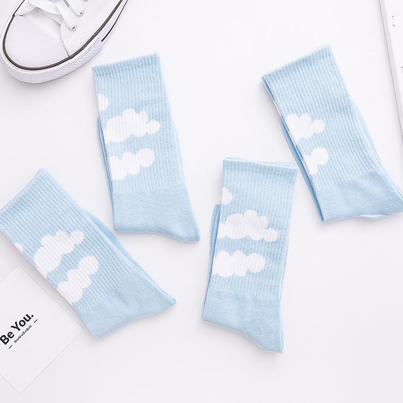 Light blue crew socks with white cloud print on the leg, ribbed knit cuffs.