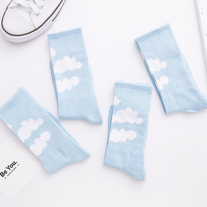 Light blue crew socks with white cloud print on the leg, ribbed knit cuffs.