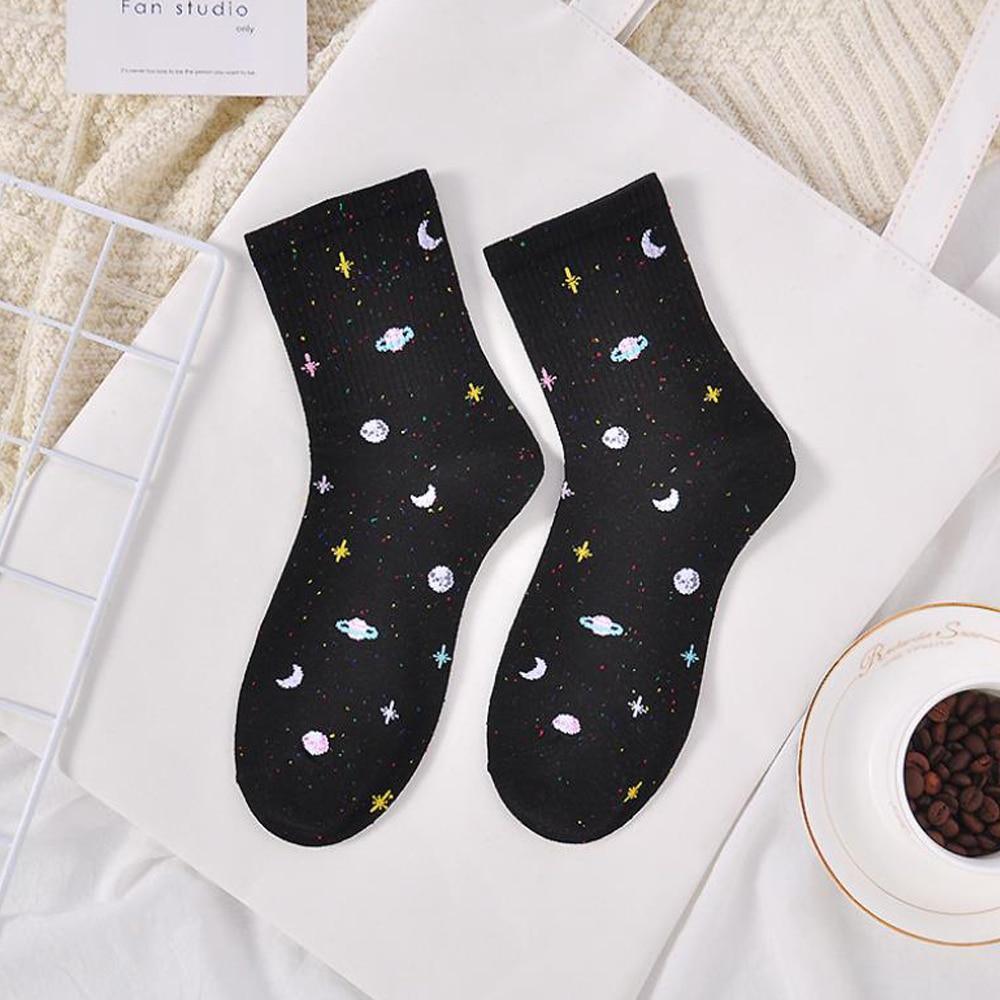 Black ribbed crew socks with colorful planet, moon, and star pattern